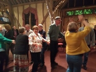 People dancing in the barn